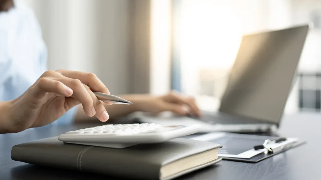 401(k) planning with a laptop and notebook