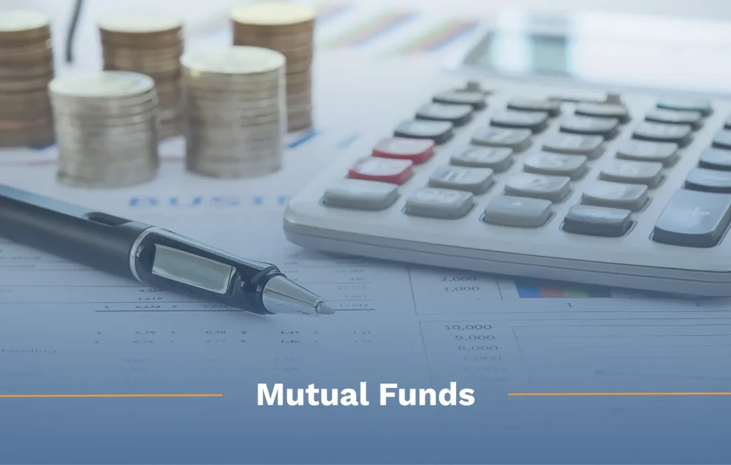 What is a mutual fund? Calculator, pen, and stacks of coins sitting on papers