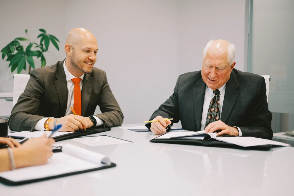 Butson Financial Advisors, LLC sitting at conference table discussing financial planning and life insurance